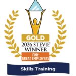 Gold Stevie Award 2026 winner for Great Employers, Skills Training badge with laurels and a figure holding a trophy triangle