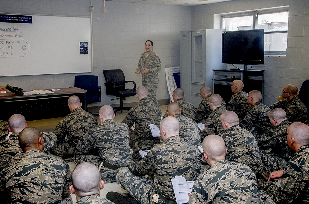 The People Behind Readiness - VPS Learning Tech. Sgt. Jennifer Severance, 331st Training Squadron military training instructor, provides a briefing to new Air Force basic trainees
